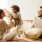 a family sitting on a bed
