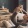 a person lying on a couch with a cat on the head