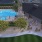 a pool with people sitting around it