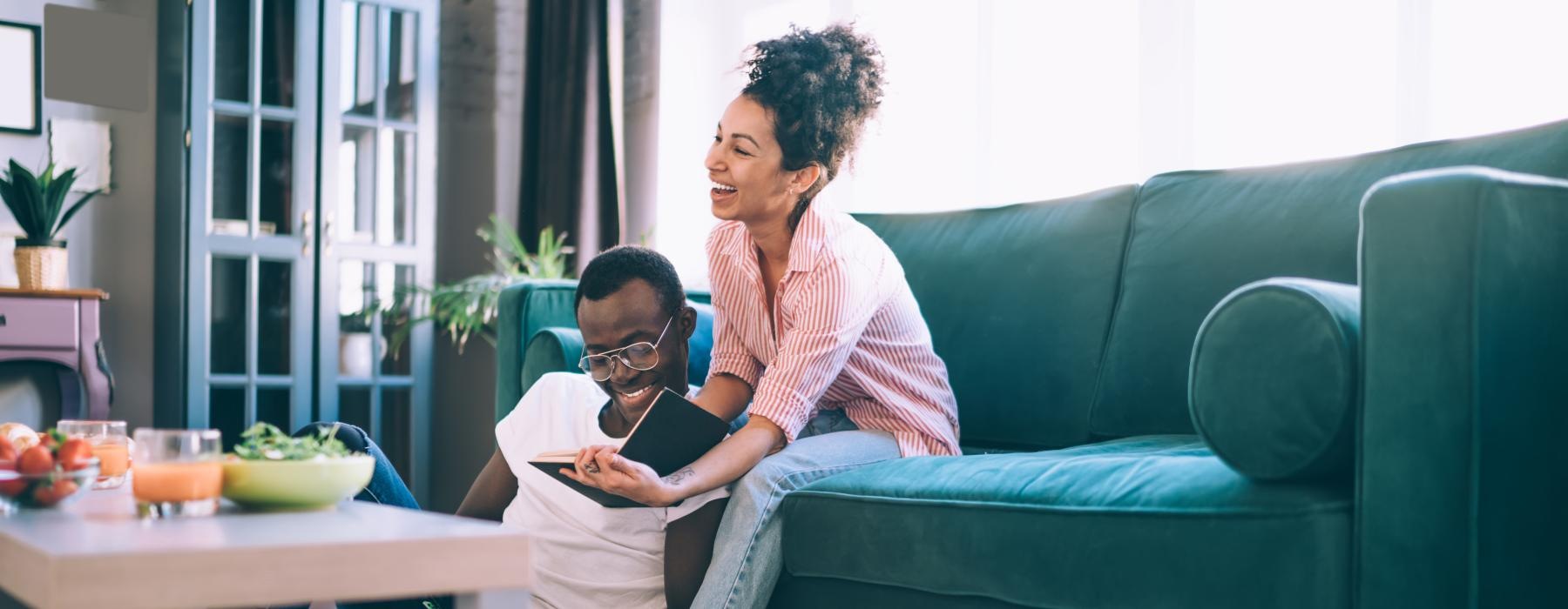 a woman and a man sitting on a couch